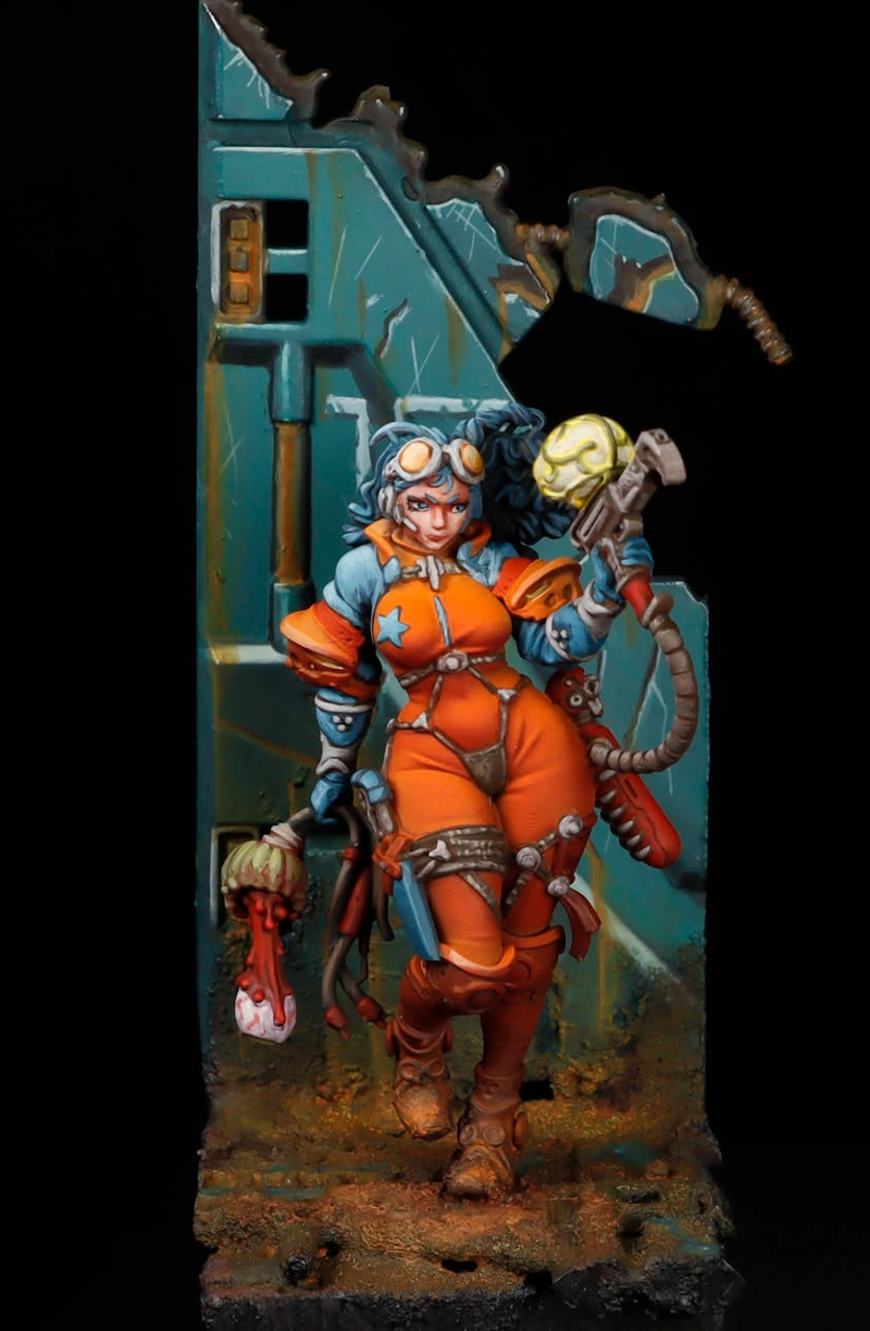 Painted Kingdom Death Sci-Fi Lucy miniature in orange spacesuit on custom teal industrial plinth with weathering and rust effects
