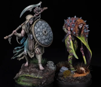 Reapokratis and Grimmory, the brothers from Kingdom Death, painted as a matching display pair Painted Kingdom Death brothers Reapokratis and Grimmory, one with scythe and face shield in brown robes, one with green skin, spiked armor, and bone sword, on scenic bases